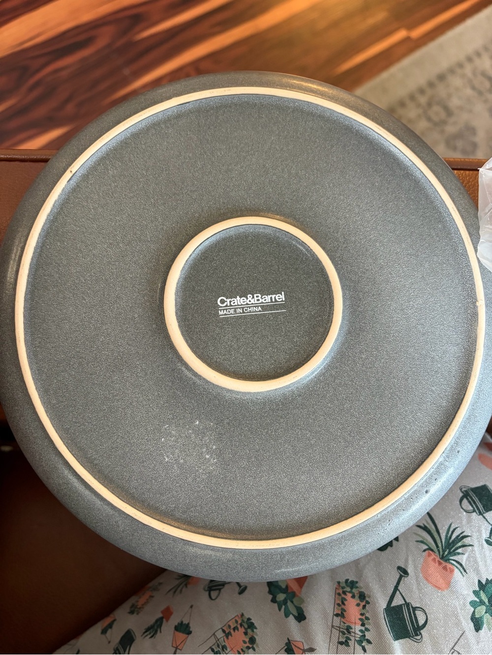 Crate&Barrel Matte Gray Stoneware Charger with Natural Rim and White candle
